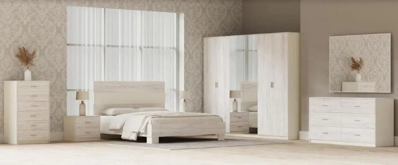 Ensemble de chambre moderne Optimum Plus avec lit, commode et armoire en bois clair, créant une atmosphère élégante et apaisante.